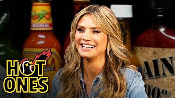 WATCH: Heidi Klum Takes Her Shirt Off On “Hot Ones”