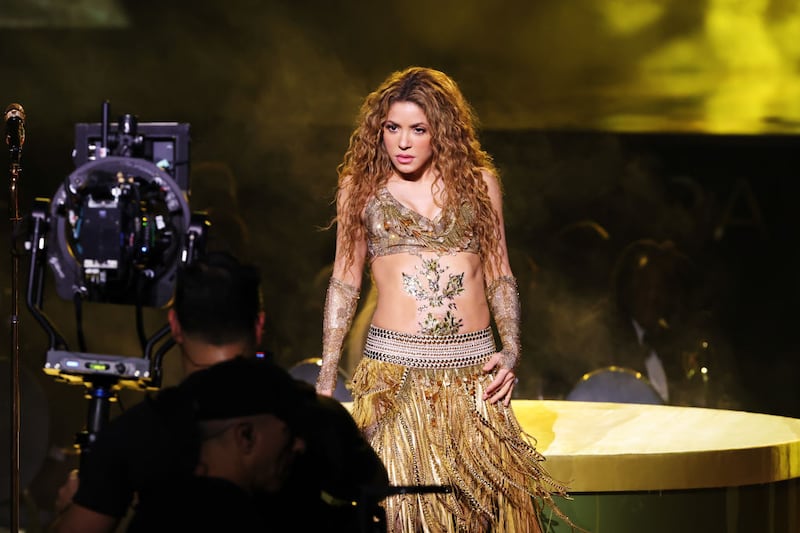 Shakira performing onstage.